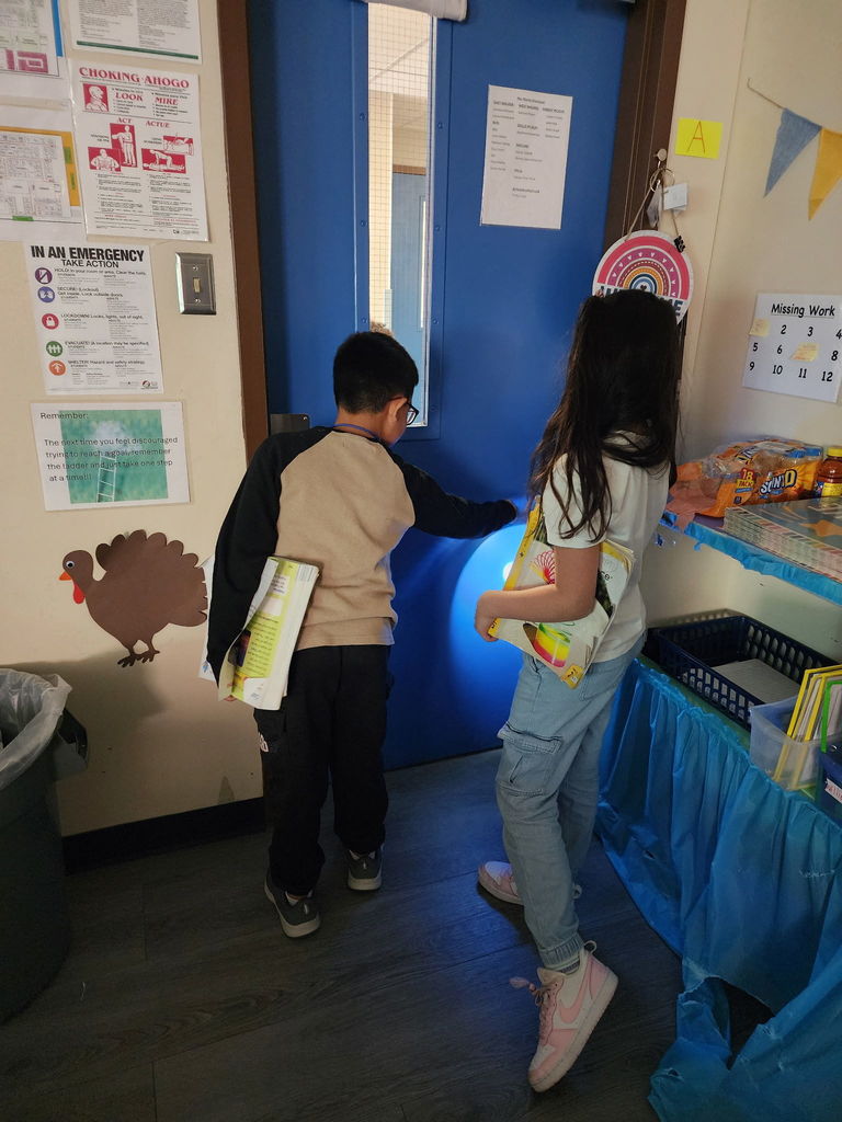 students with flashlights