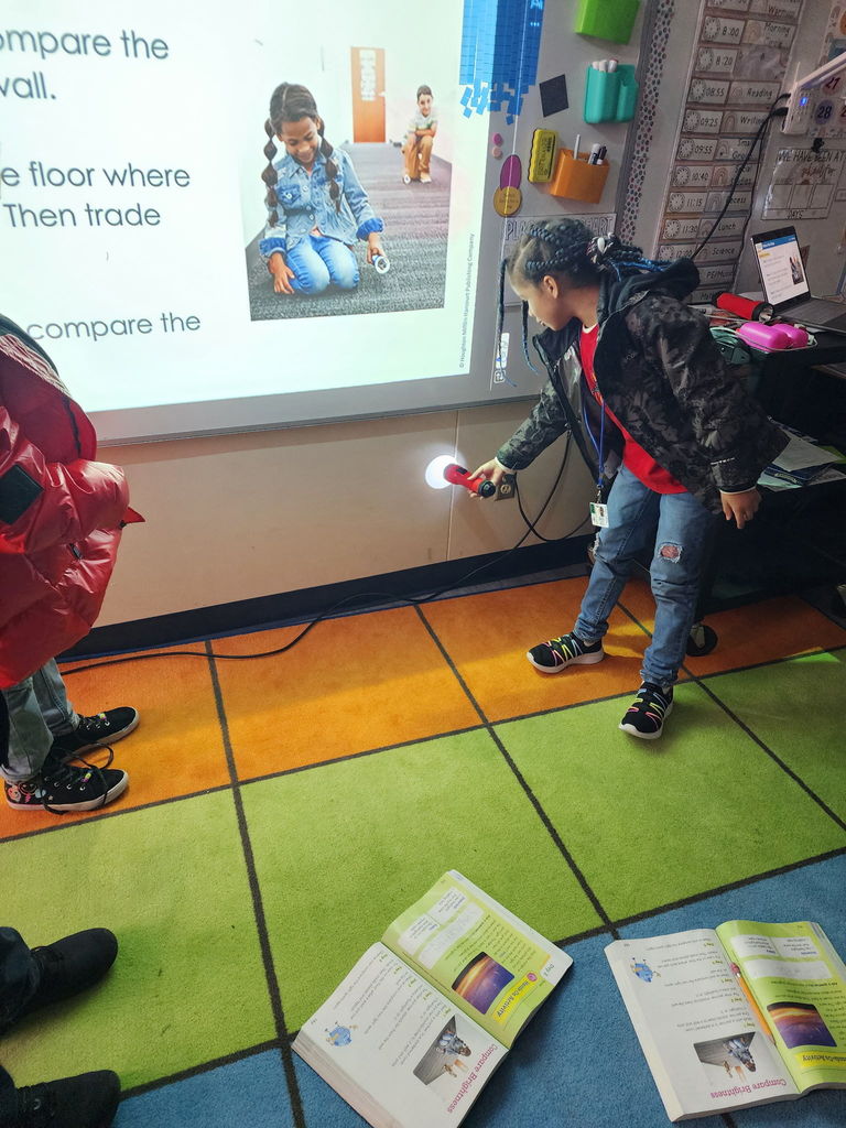 students with flashlights