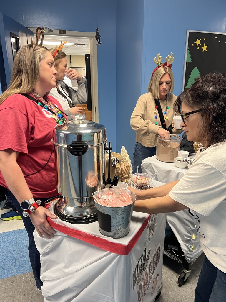 Teacher getting the hot cocoa ready.