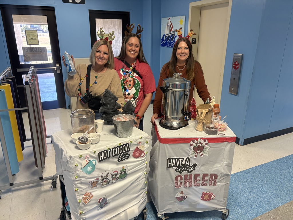 Teachers with the cart smiling.