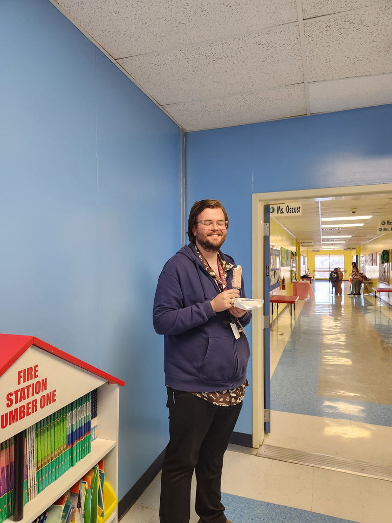 Teacher enjoying icecream bar.