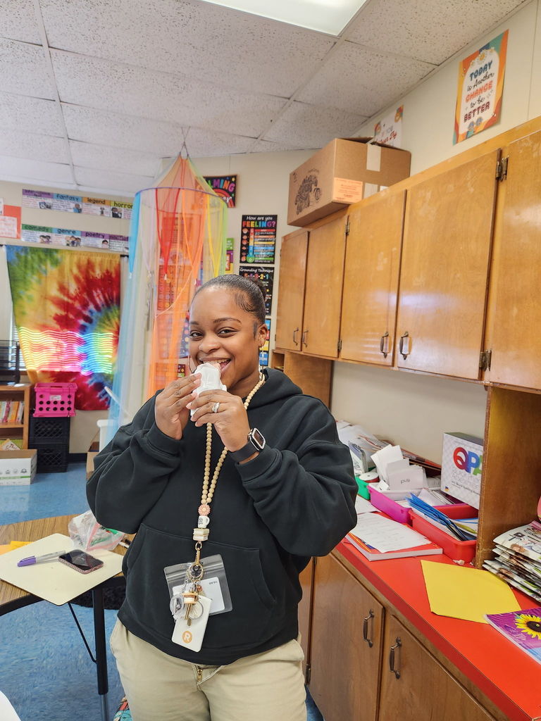Teacher enjoying icecream bar.