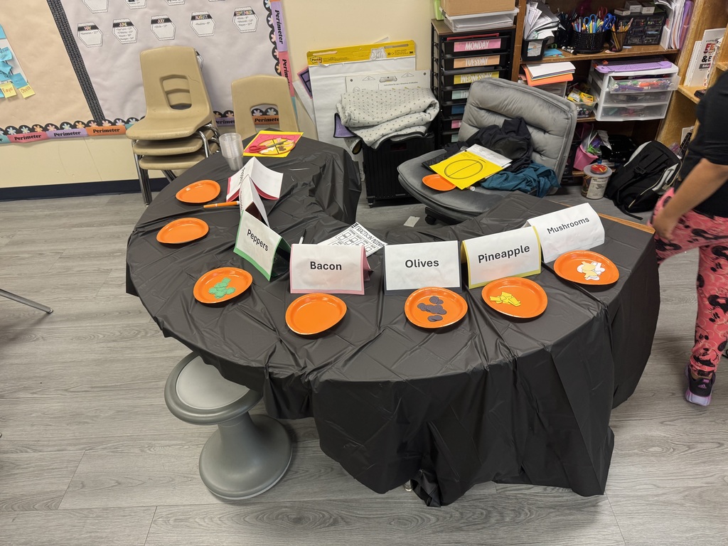 black tablecloth with orange plates