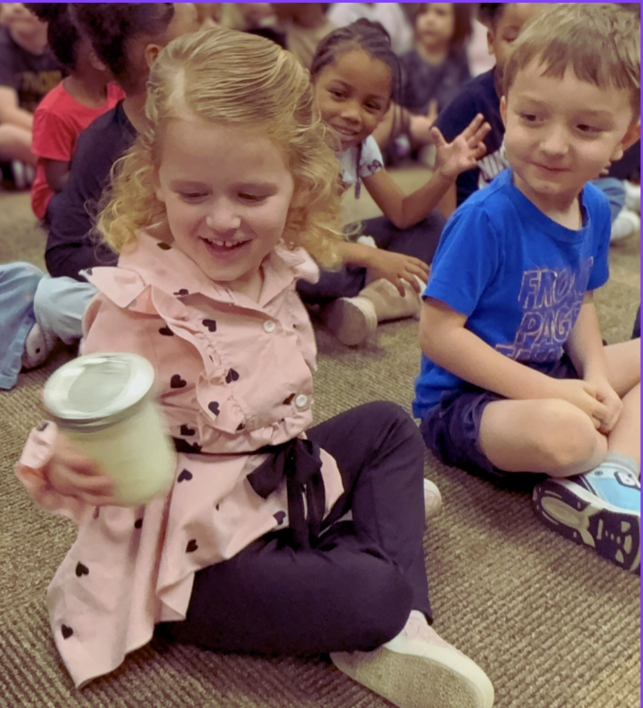 children shaking mason jar