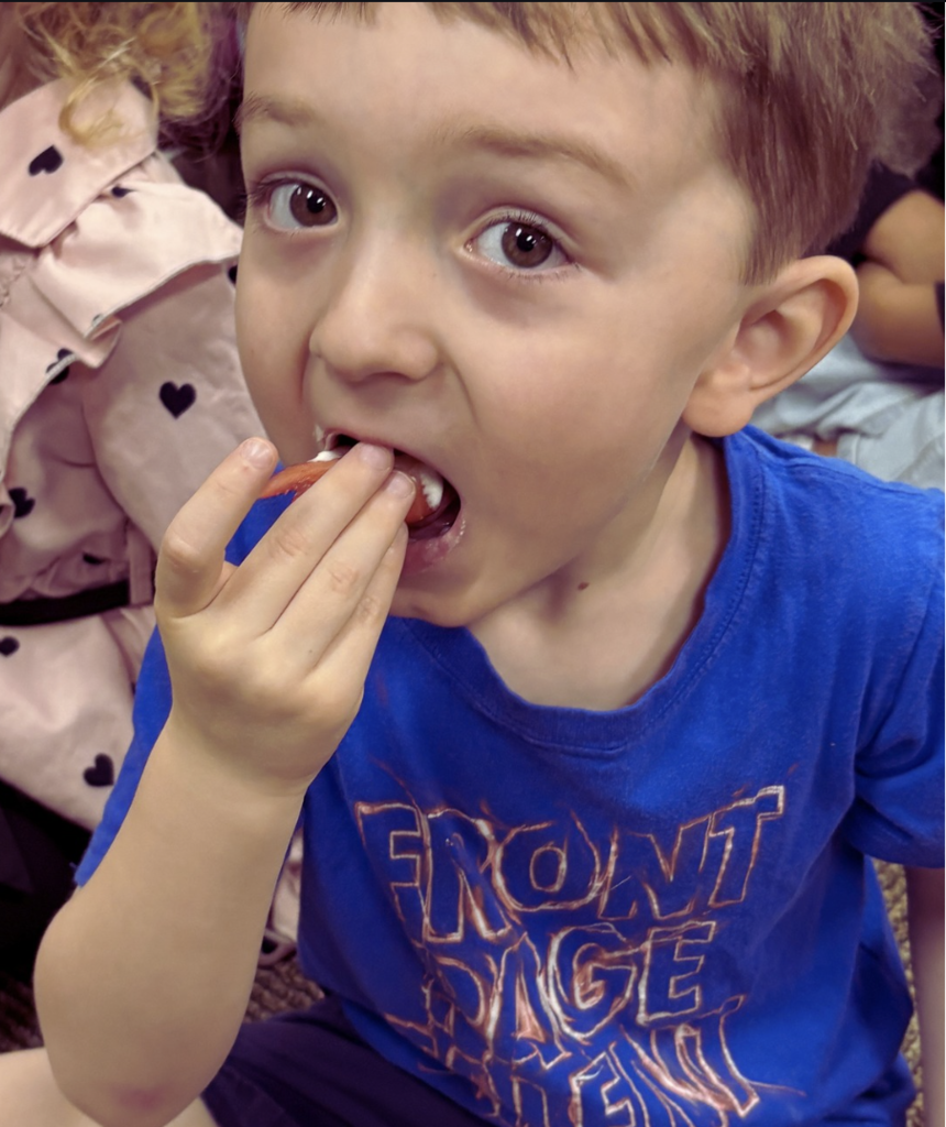 student eating a strawberry