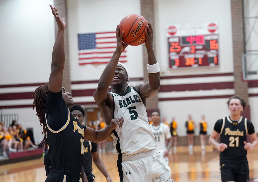Ellison basketball player jumps to the hoop
