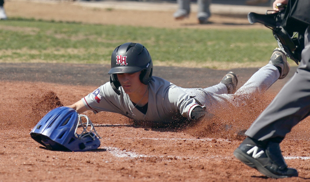 HHHS runner slides into home