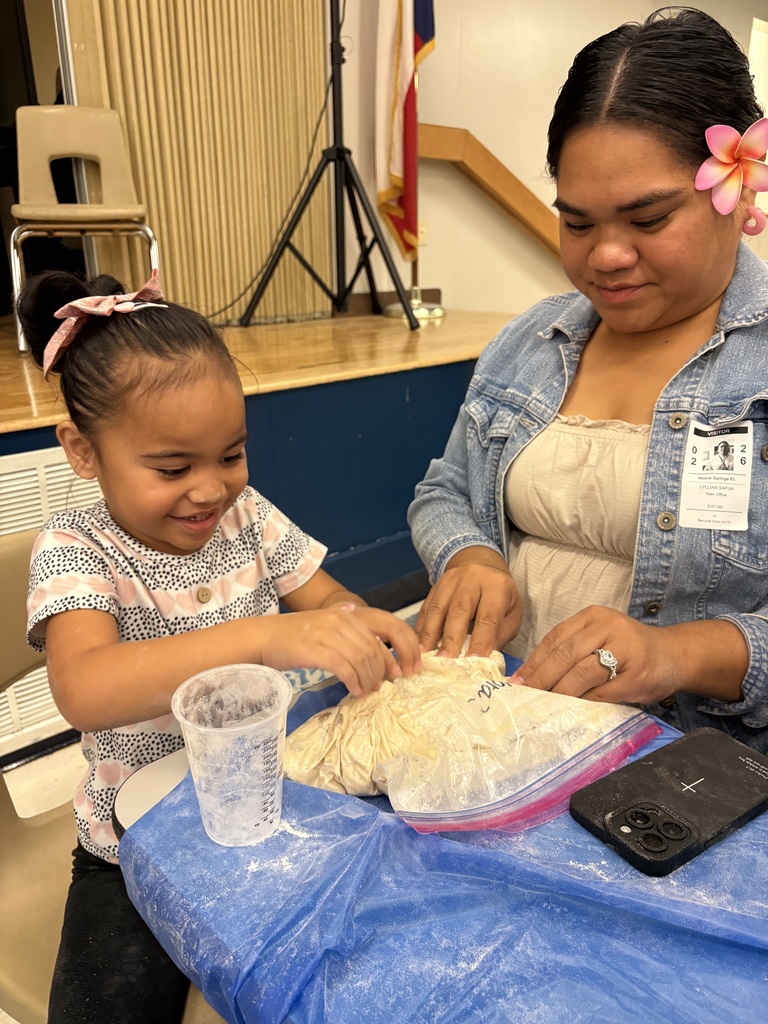 students and families making bread in a bag