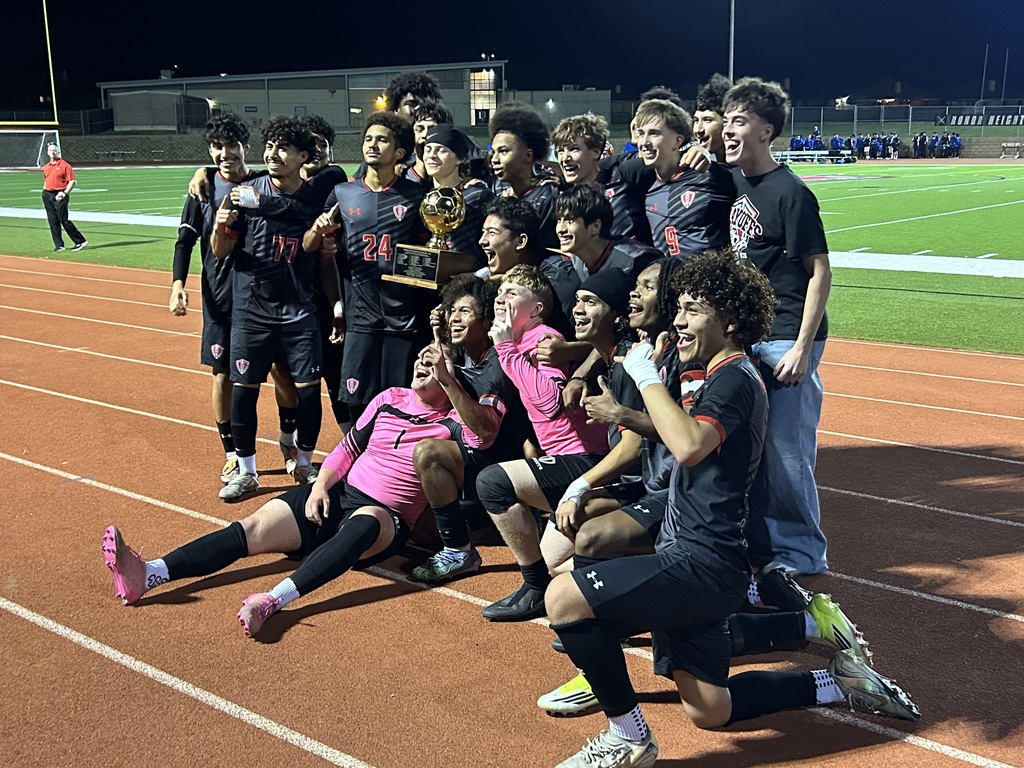 Harker Heights boys soccer teams poses with the district title trophy.