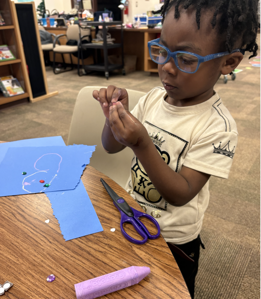 Student creating a heart