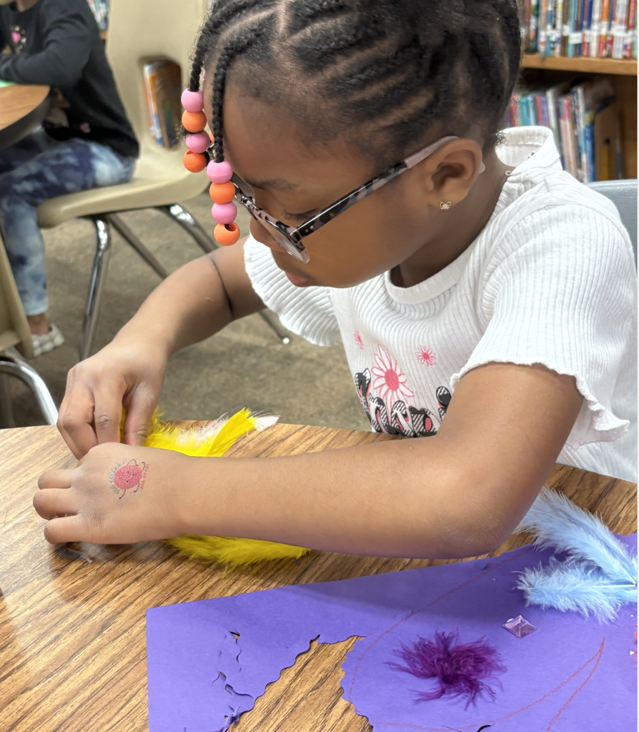 Student creating a heart