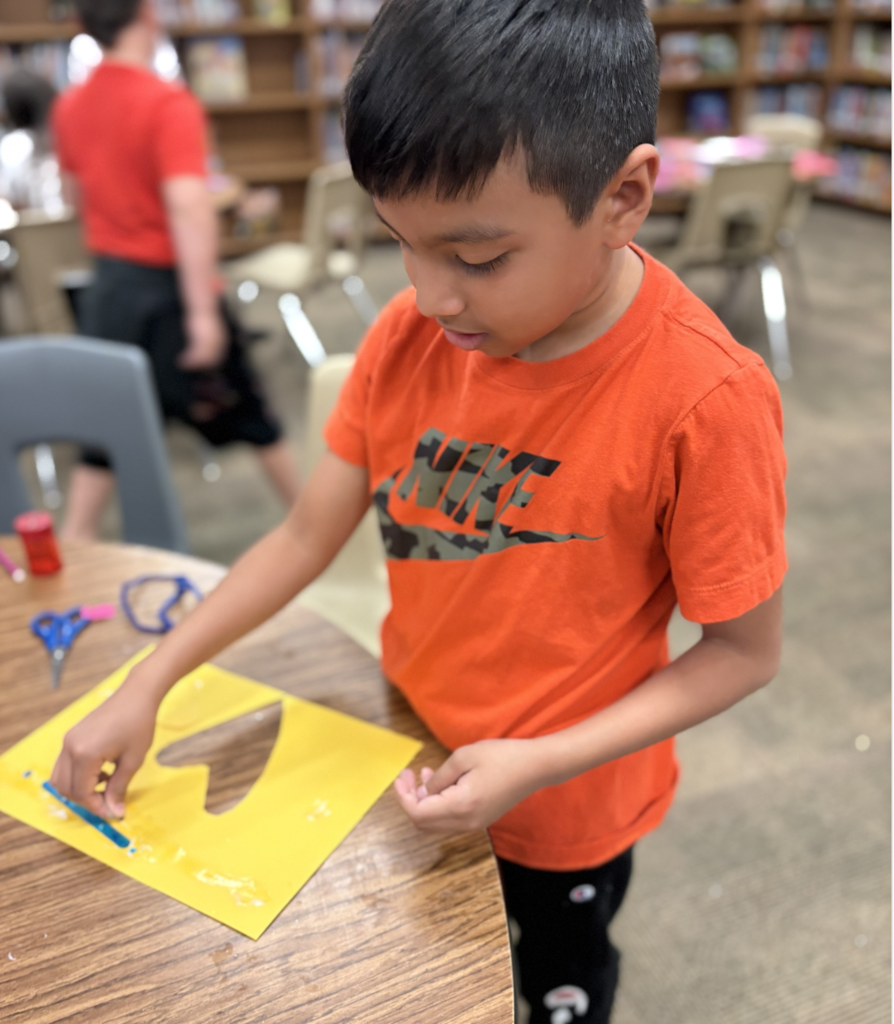 student creating a heart