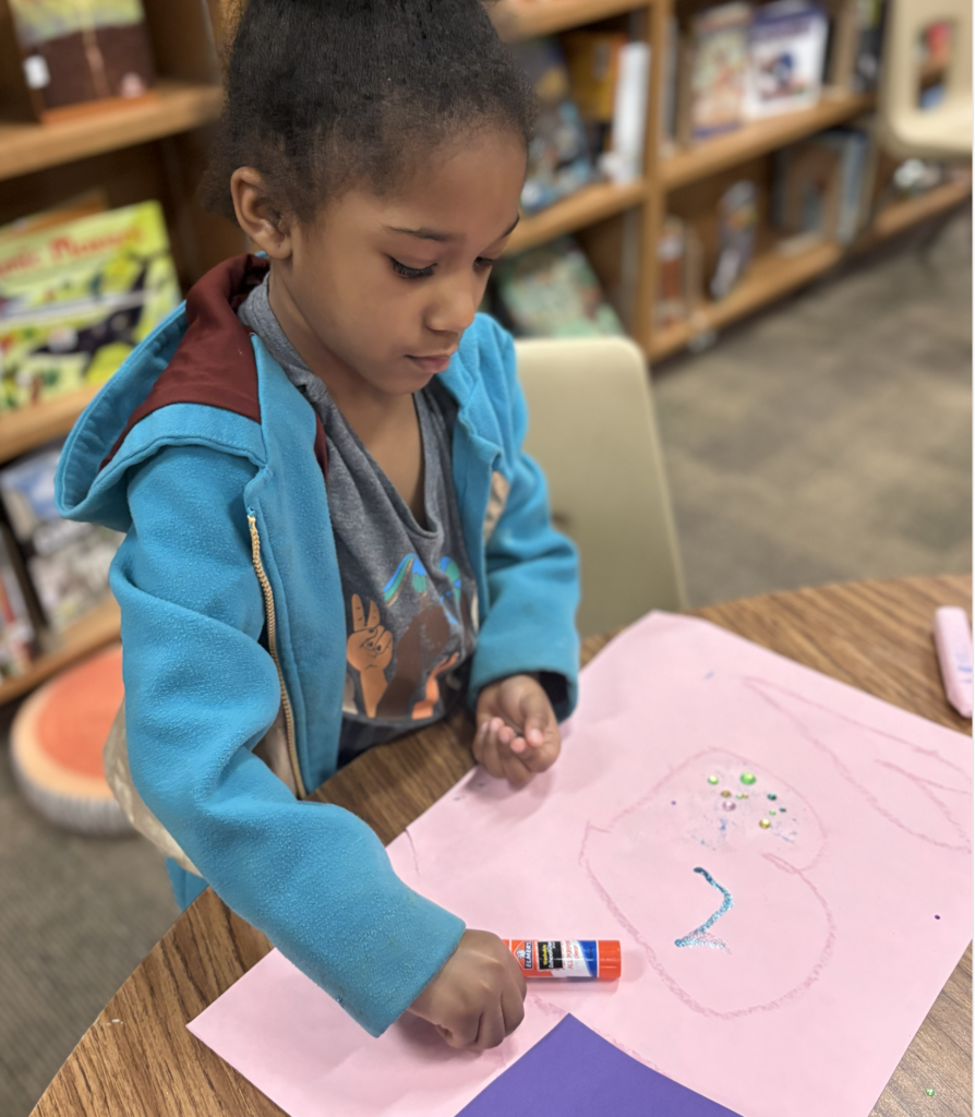 Student creating a heart