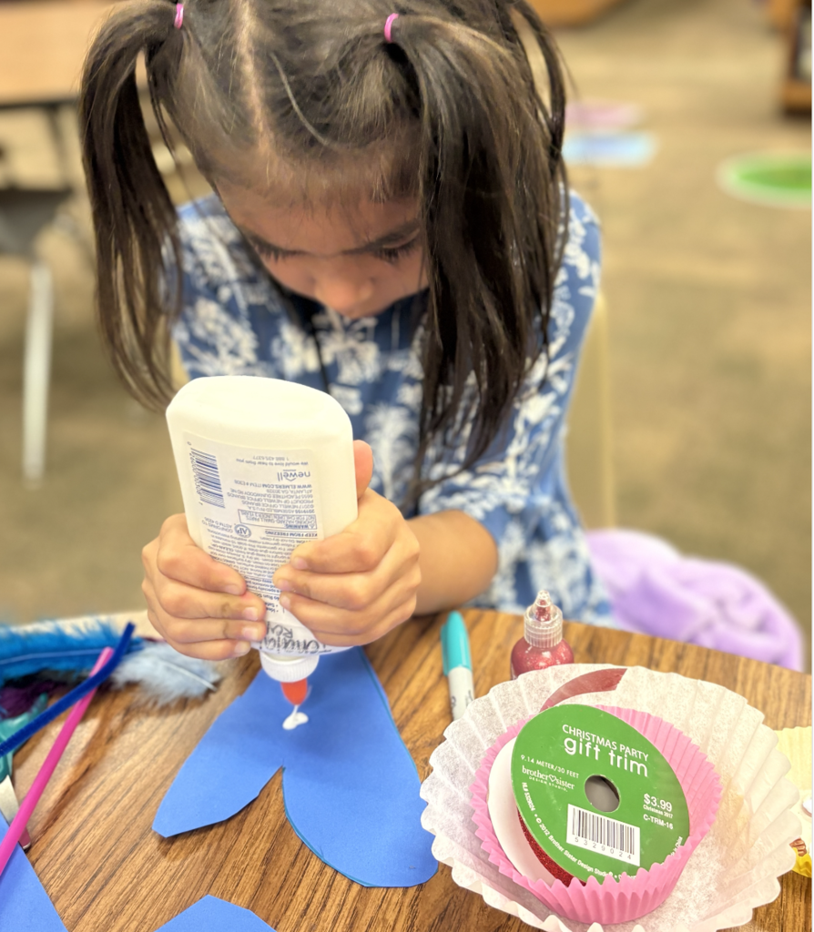 Student creating a heart