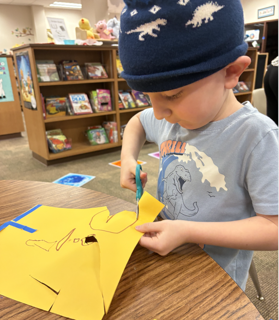 student creating a heart