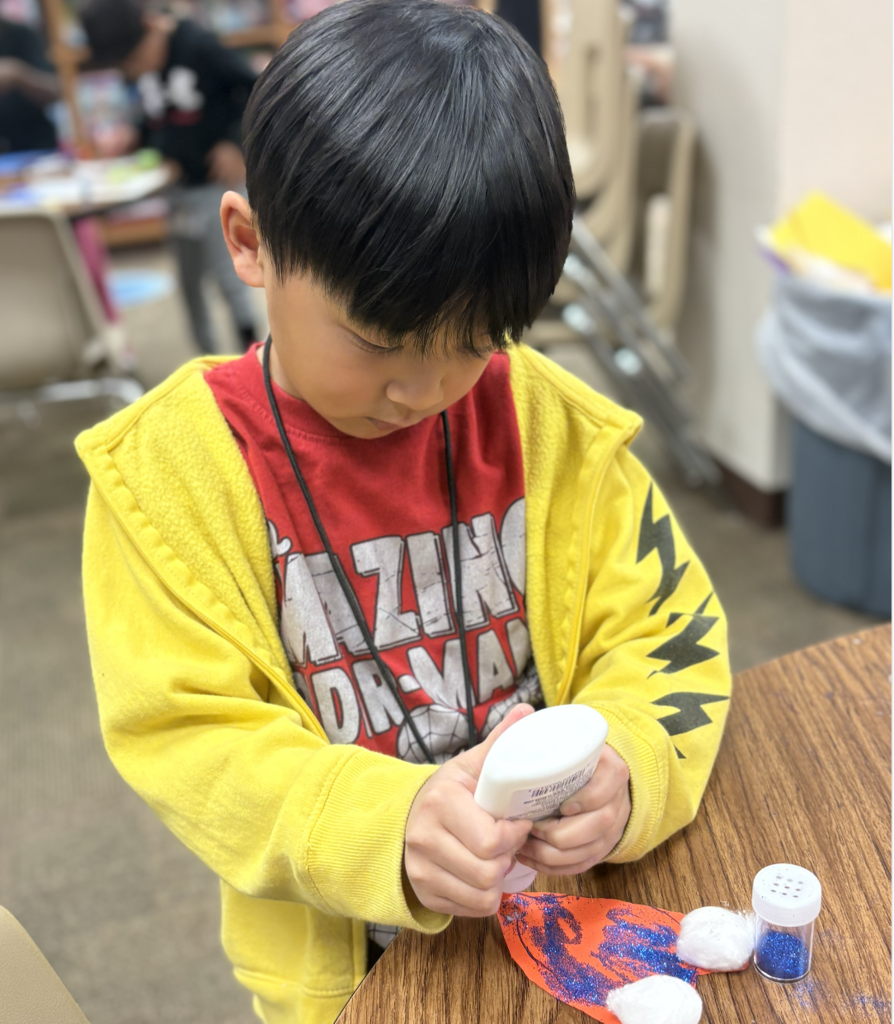 Student creating a heart