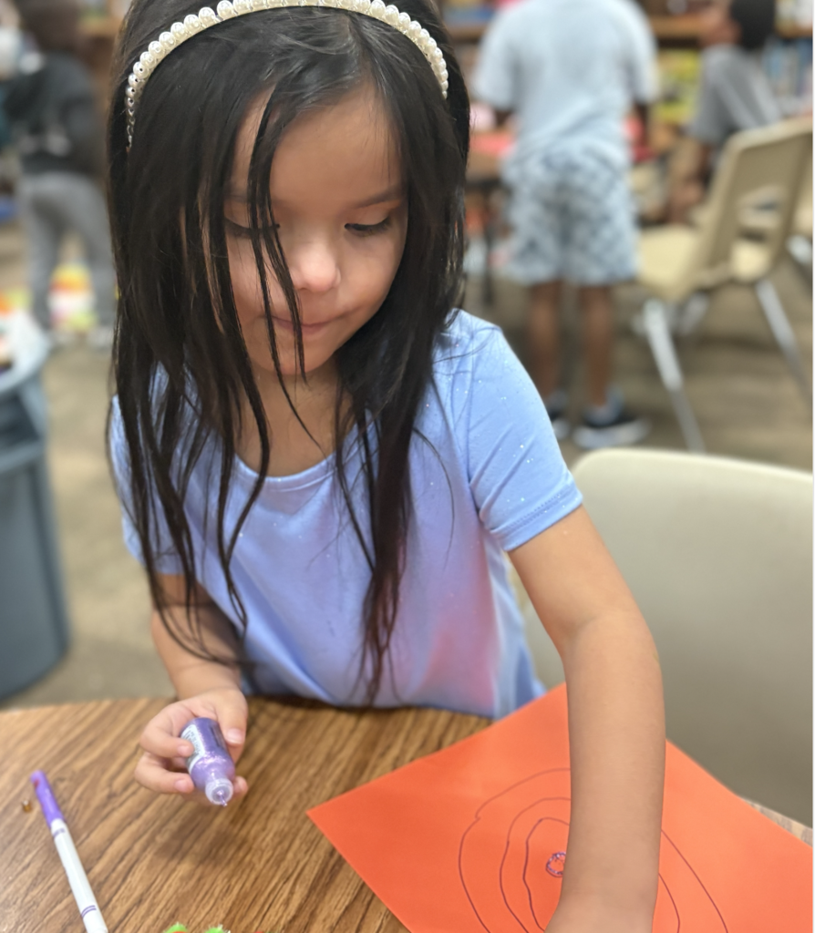 student creating a heart