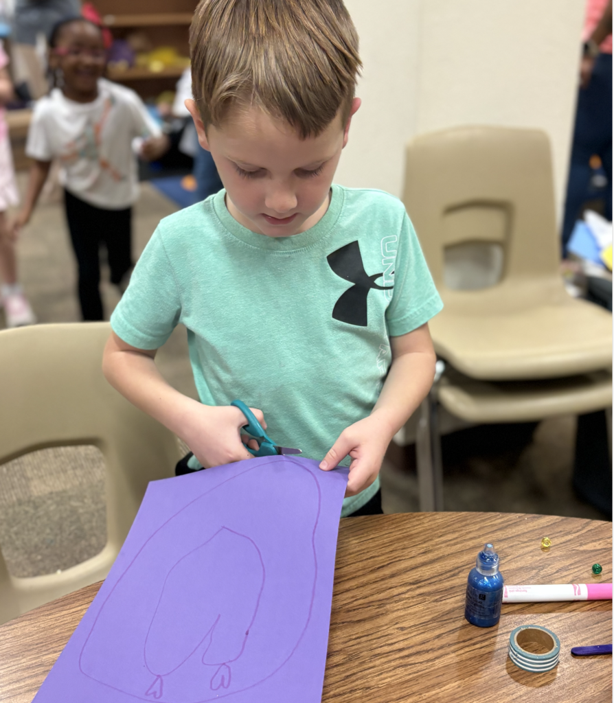 student creating a heart