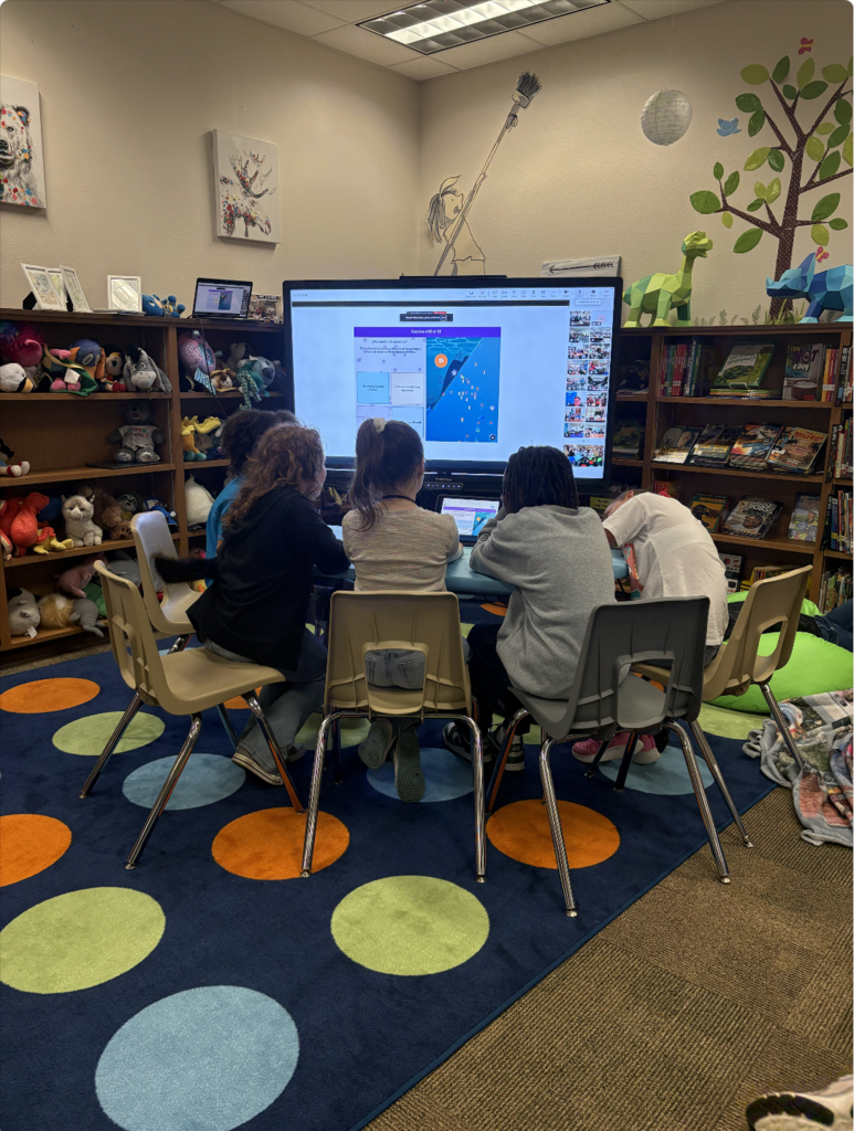 students working on an ipad