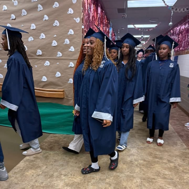 students wearing cap and gown