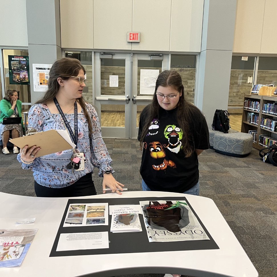 A judge provides feedback to a student