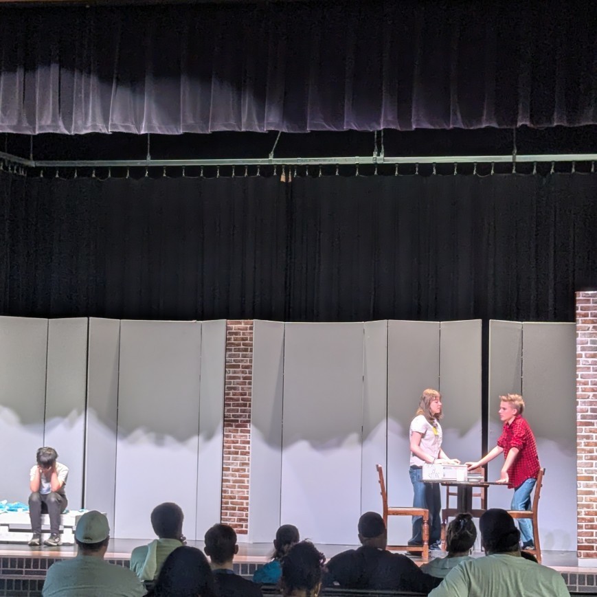 Three students perform Misunderstood 