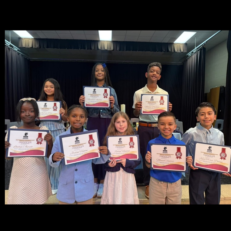 NEHS students holding certificates 