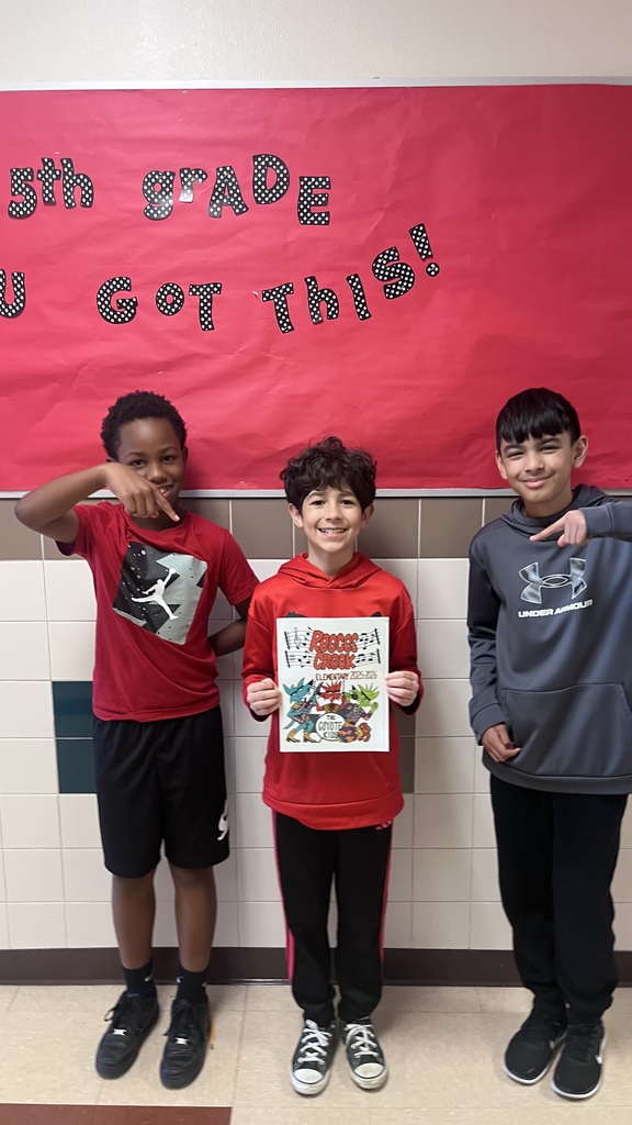 Students holding yearbooks