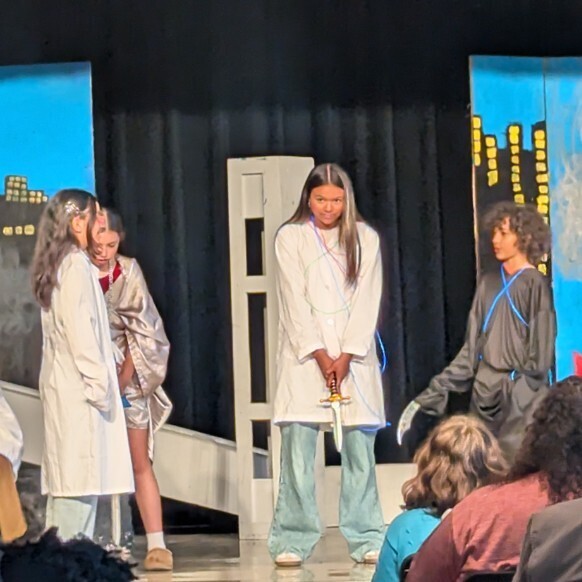 Three students in Doctors coats 