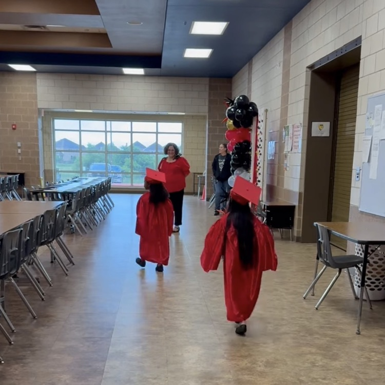 kinder graduates walking