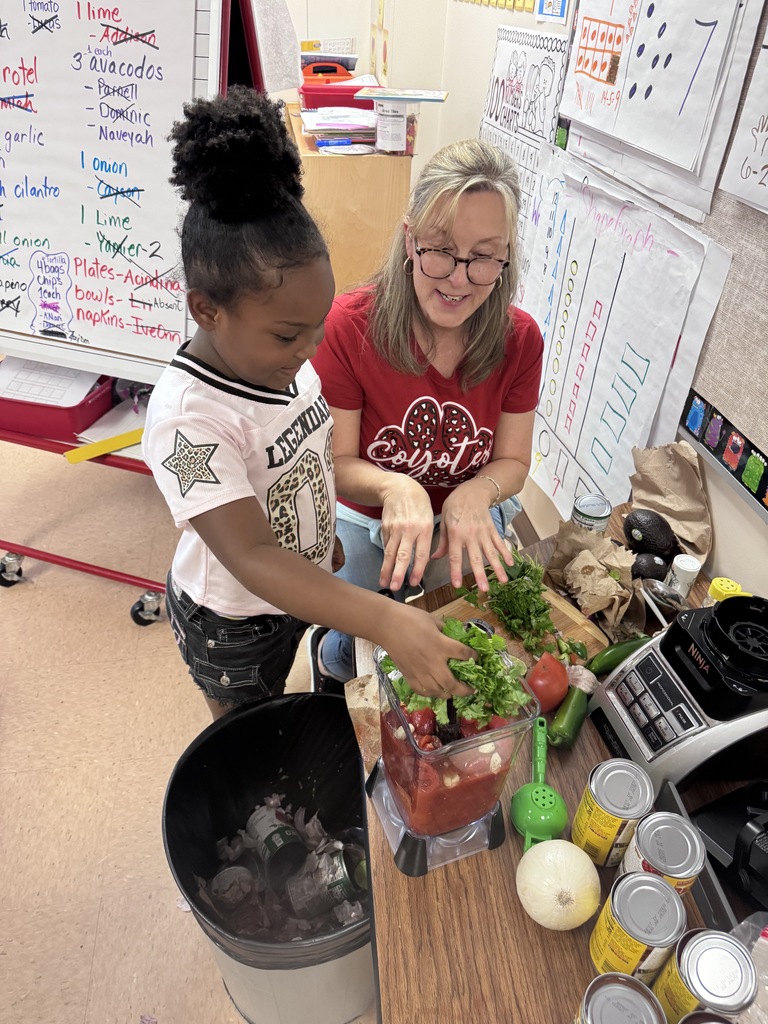 student and adult making salsa