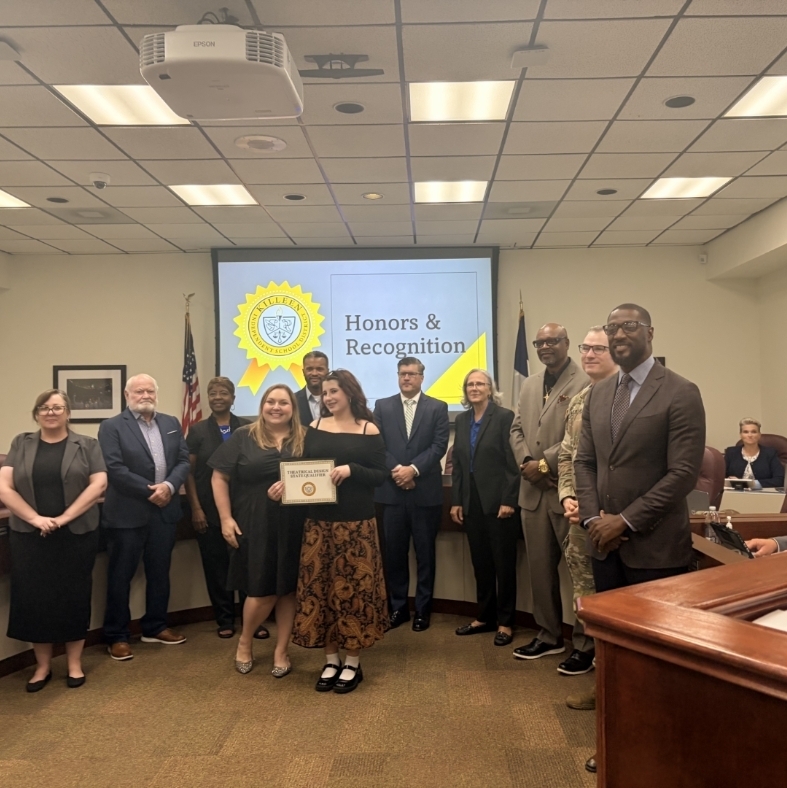 School board recognition photo with Design qualifier and teacher