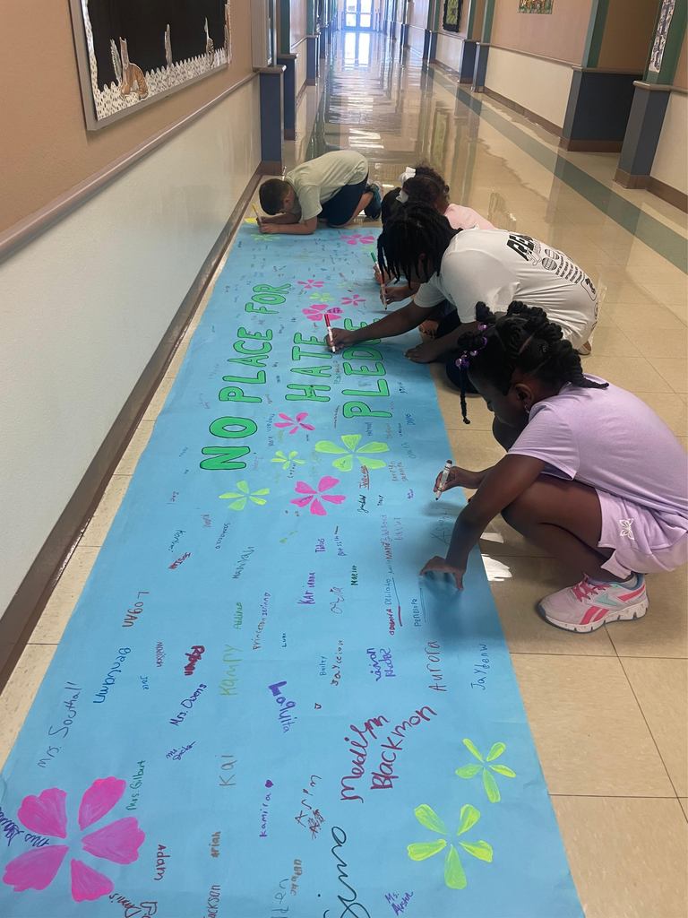 Mrs. Sims Class signing the no place for hate banner