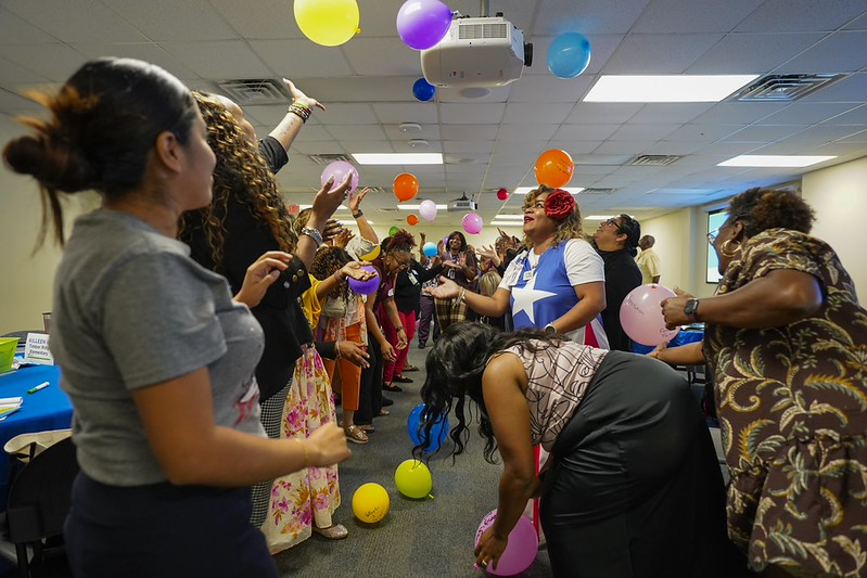 balloons in the air and holding