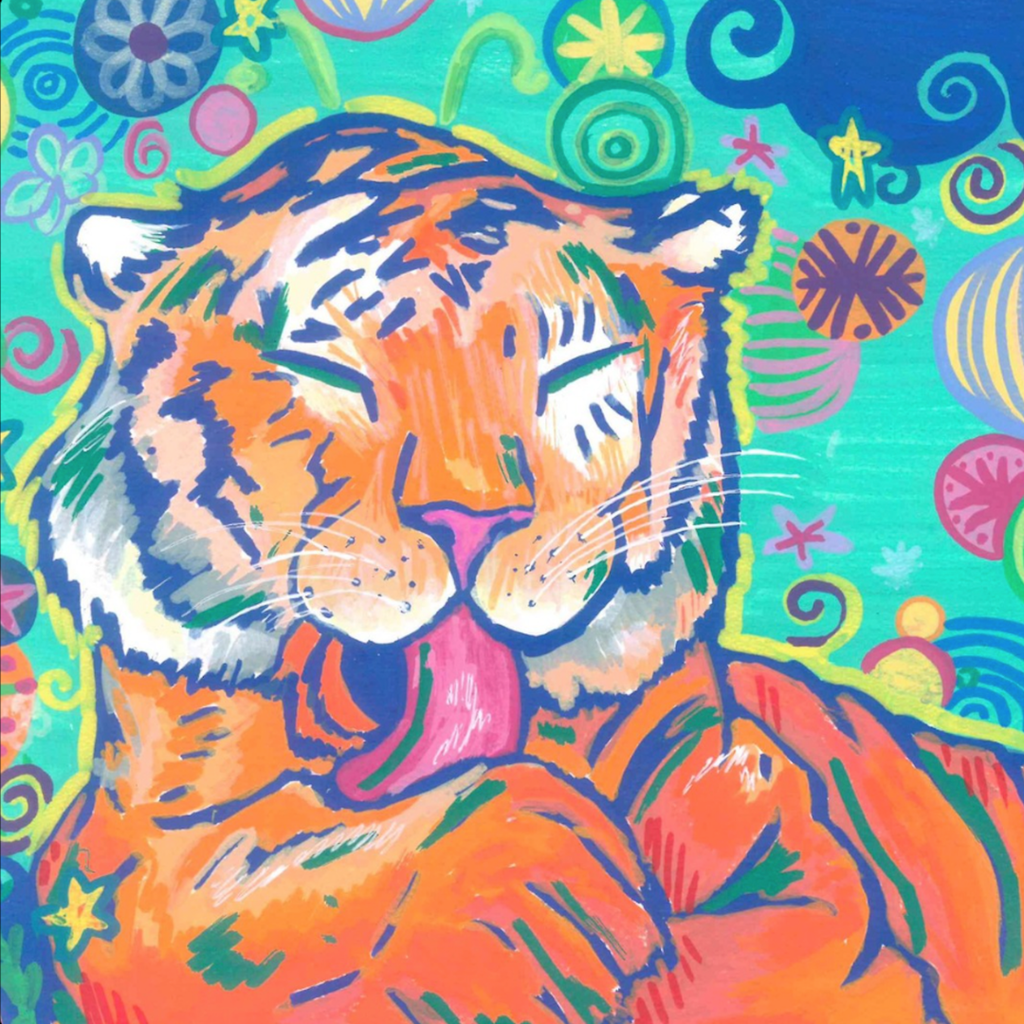 An orange and black tiger with a pink tongue, blue eyes, and closed eyes rests on a colorful, patterned background.