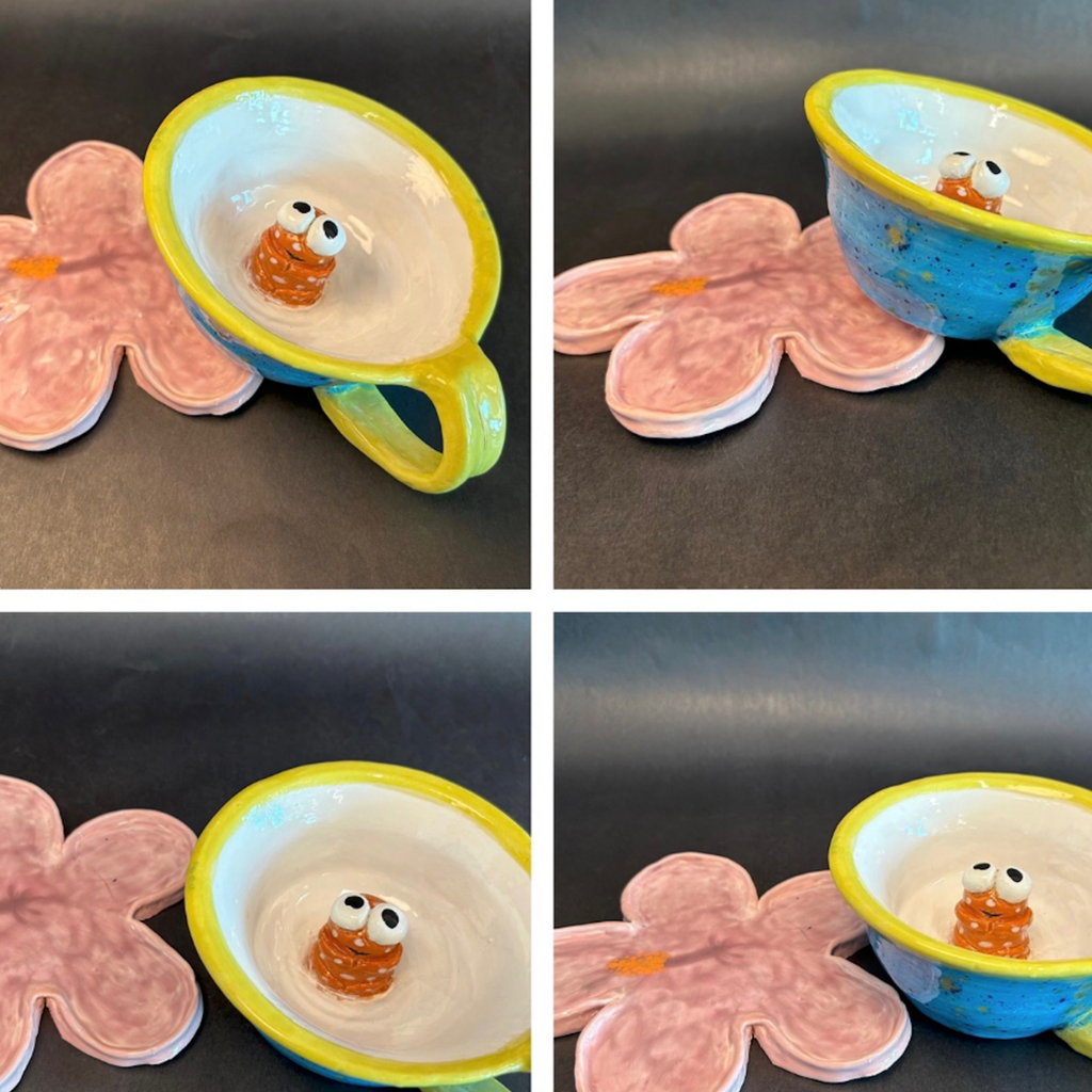 Four views of a cup. Each view shows the cup's inside, featuring a small, orange, and white character.