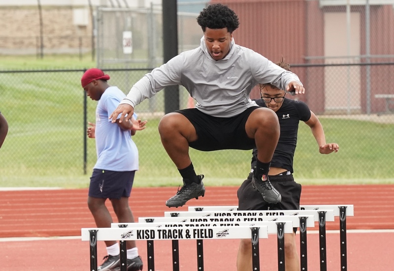 KHS athlete leaps over a hurdle