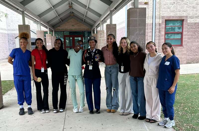 HHHS volleyball Aaliyah Johnson and team