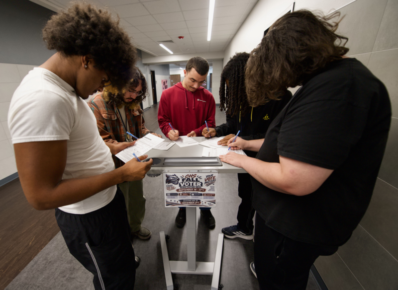 18-year-old students fill out voter registration forms