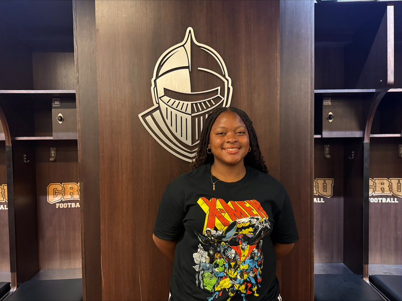 photo of smiling student in locker room