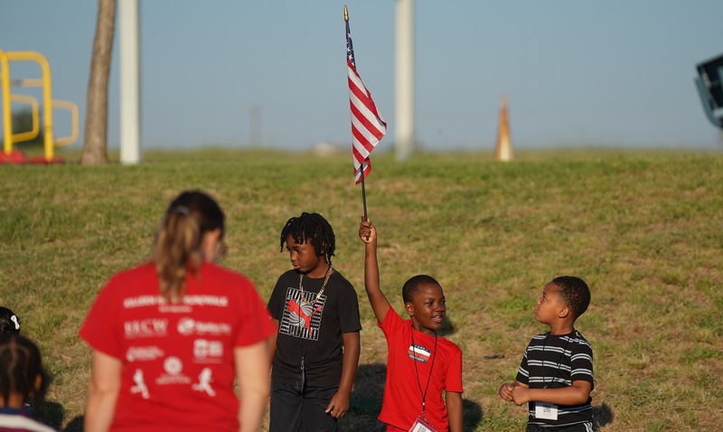 Reeces Creek students hoists American flag