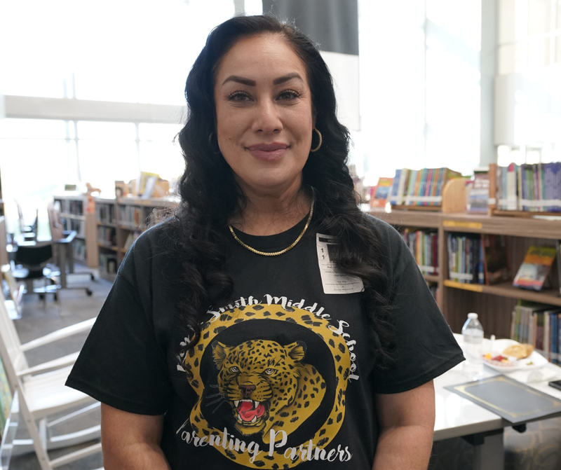 woman looking at the camera smiling 