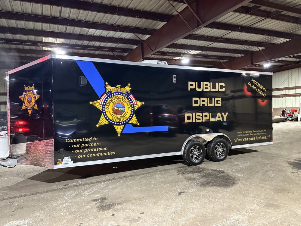 Black trainler with police emblem and logo with public drug display