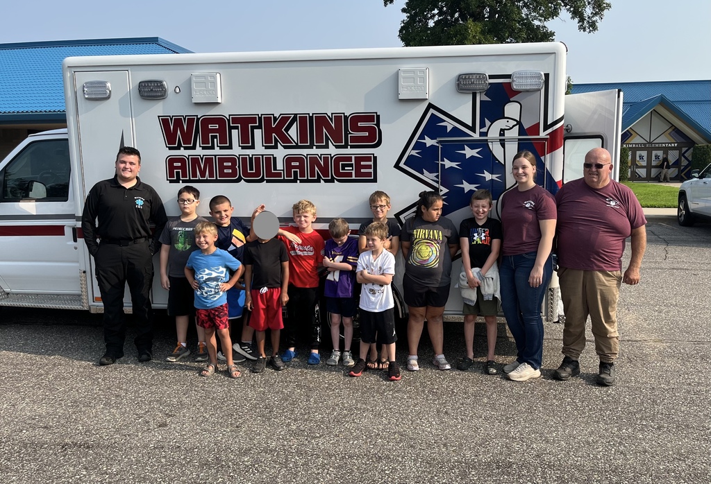 students in front of ambulance