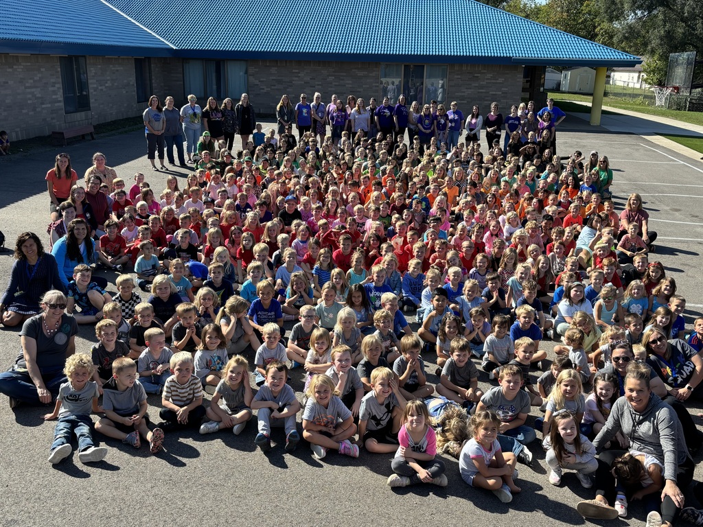 all school group photo of color by grade level dress up day