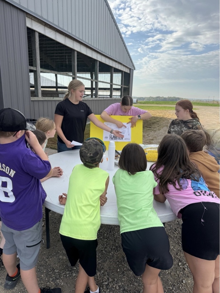students outside around table