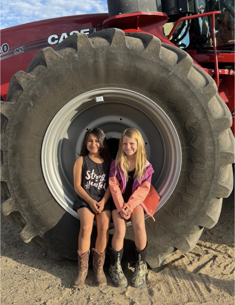 two girls in tractor tire