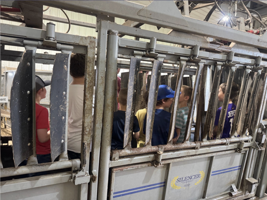 student behind feeding stations