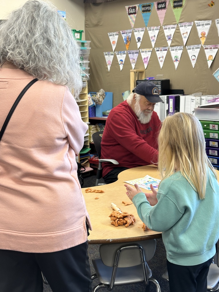 grandparents doing clay work with student