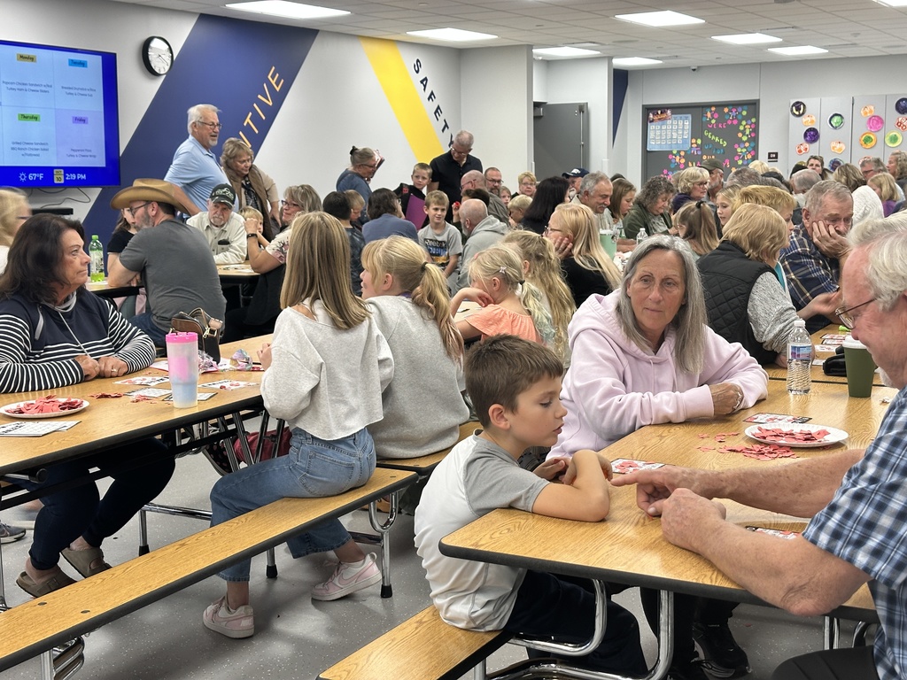 students and grandparents playing bingo